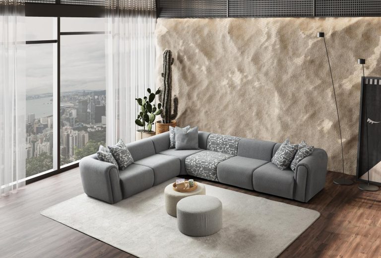 Ecksofa mit breit geführter Eckpolsterung und tief auslaufender Lounge-Polsterung in Variante 4 – Ahié