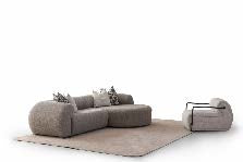 Ecksofa mit breit geführter Eckpolsterung und tief auslaufender Lounge-Polsterung in Variante 5 – Ahié